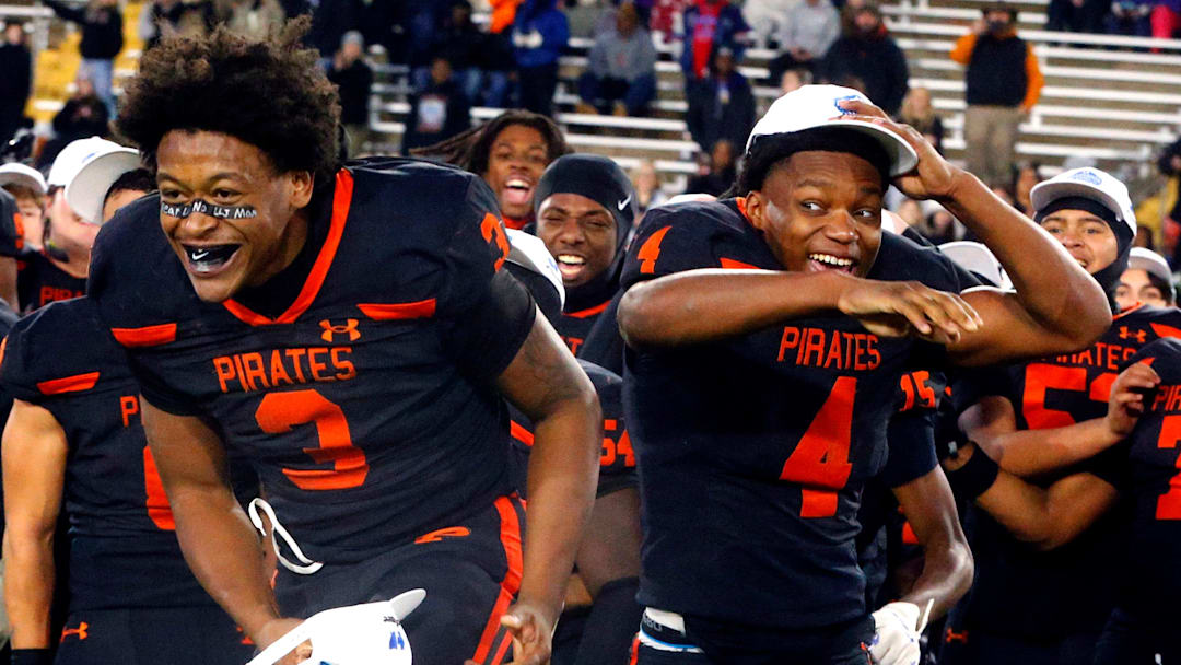 South Pittsburg's running back Ja'mychal Buckner (3) goes up to accept the MVP award as South Pittsburg's wide receiver Brandon Goldsmith (4) congratulates him after South Pittsburg beat McKenzie in the 2025 TSSAA Class 1A Football State Championship game on Friday, Dec. 5, 2025, at Finley Stadium in Chattanooga.