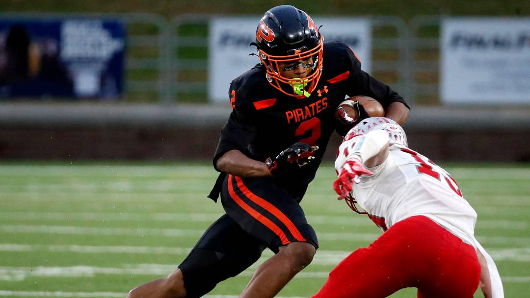 South Pittsburg's Dayon Cooper (2) carries the ball as McKenzie's Avery Brown (13) goes for a tackle during the 2025 TSSAA Class 1A Football State Championship game on Friday, Dec. 5, 2025, at Finley Stadium in Chattanooga.