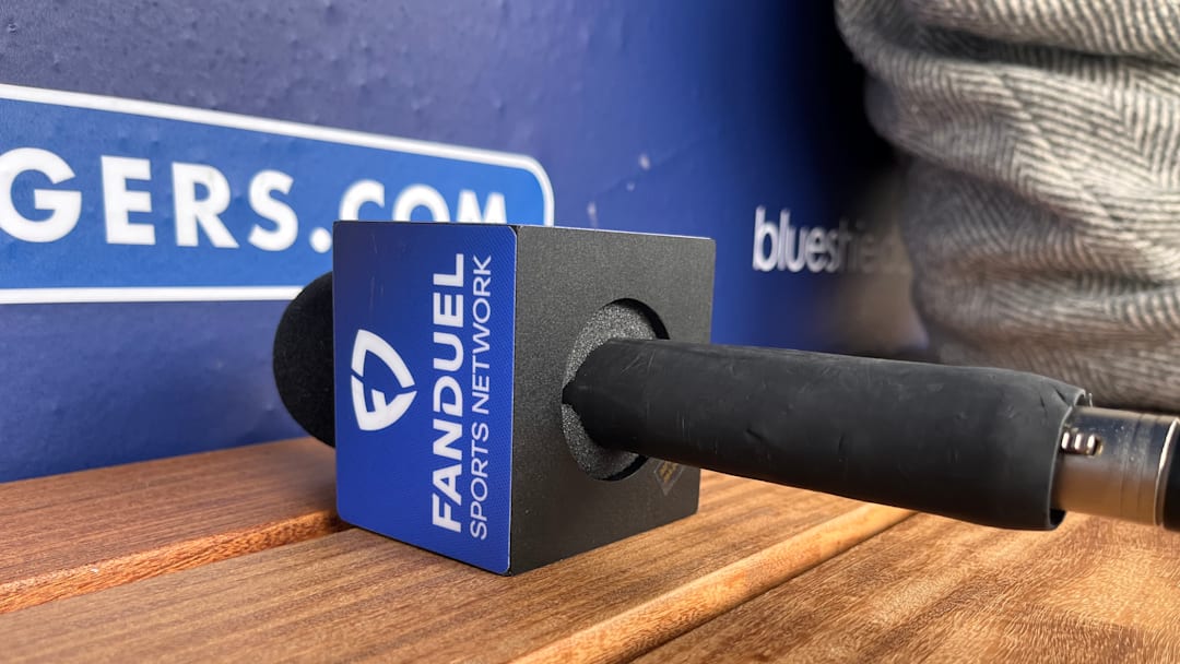 A FanDuel Sports Network microphone sits on the bench at Dodger Stadium in Los Angeles, California.
