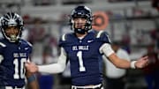 Del Valle High School's Jake Fette talks to his sideline during their game against Cooper High School at Del Valle High School on Nov. 14, 2024. Del Valley won their opening playoff game.