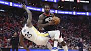 Dec 11, 2024; Houston, Texas, USA; Houston Rockets forward Tari Eason (17) controls the ball as Golden State Warriors forward Draymond Green (23) loses balance during the fourth quarter at Toyota Center. Mandatory Credit: Troy Taormina-Imagn Images