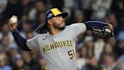 Oct 9, 2025; Chicago, Illinois, USA; Milwaukee Brewers pitcher Freddy Peralta (51) throws pitch against the Chicago Cubs during the first inning for game four of the NLDS round for the 2025 MLB playoffs at Wrigley Field. Mandatory Credit: David Banks-Imagn Images