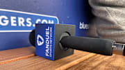 A FanDuel Sports Network microphone sits on the bench at Dodger Stadium in Los Angeles, California.
