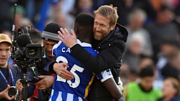 Graham Potter celebrates with Moises Caicedo while together at Brighton