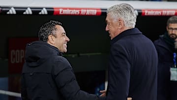 Real Madrid head coach Carlo Ancelotti (R) and FC Barcelona...