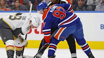 Dec 14, 2024; Edmonton, Alberta, CAN;  Edmonton Oilers forward Connor McDavid (97) wins a face-off over Vegas Golden Knights forward Jack Eichel (9) during the second period at Rogers Place. Mandatory Credit: Perry Nelson-Imagn Images