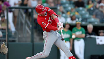 May 19, 2025; West Sacramento, California, USA; Los Angeles Angels catcher Logan O'Hoppe (14) hits a single against the Athletics during the second inning at Sutter Health Park. Mandatory Credit: Dennis Lee-Imagn Images