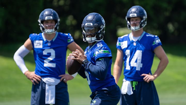 Jun 11, 2025; Renton, WA, USA; Seattle Seahawks quarterback Jalen Milroe (6) looks to pass as quarterback Drew Lock (2) and quarterback Sam Darnold (14) during mini-camp at Virginia Mason Athletic Center. Jun 11, 2025; Renton, WA, USA; Seattle Seahawks quarterback Jalen Milroe (6) looks to pass as quarterback Drew Lock (2) and quarterback Sam Darnold (14) during mini-camp at Virginia Mason Athletic Center.