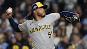 Oct 9, 2025; Chicago, Illinois, USA; Milwaukee Brewers pitcher Freddy Peralta (51) throws pitch against the Chicago Cubs during the first inning for game four of the NLDS round for the 2025 MLB playoffs at Wrigley Field. Mandatory Credit: David Banks-Imagn Images