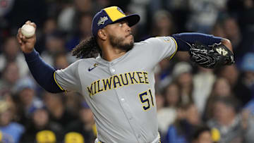 Oct 9, 2025; Chicago, Illinois, USA; Milwaukee Brewers pitcher Freddy Peralta (51) throws pitch against the Chicago Cubs during the first inning for game four of the NLDS round for the 2025 MLB playoffs at Wrigley Field. Mandatory Credit: David Banks-Imagn Images
