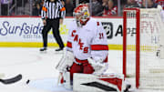 Apr 25, 2025; Newark, New Jersey, USA; Carolina Hurricanes goaltender Frederik Andersen (31) makes a save against the New Jersey Devils during the first overtime in game three of the first round of the 2025 Stanley Cup Playoffs at Prudential Center. Mandatory Credit: Ed Mulholland-Imagn Images
