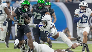 Penn State football safety Zakee Wheatley and Oregon football running back Noah Whittington at the 2024 Big Ten Football Championship.