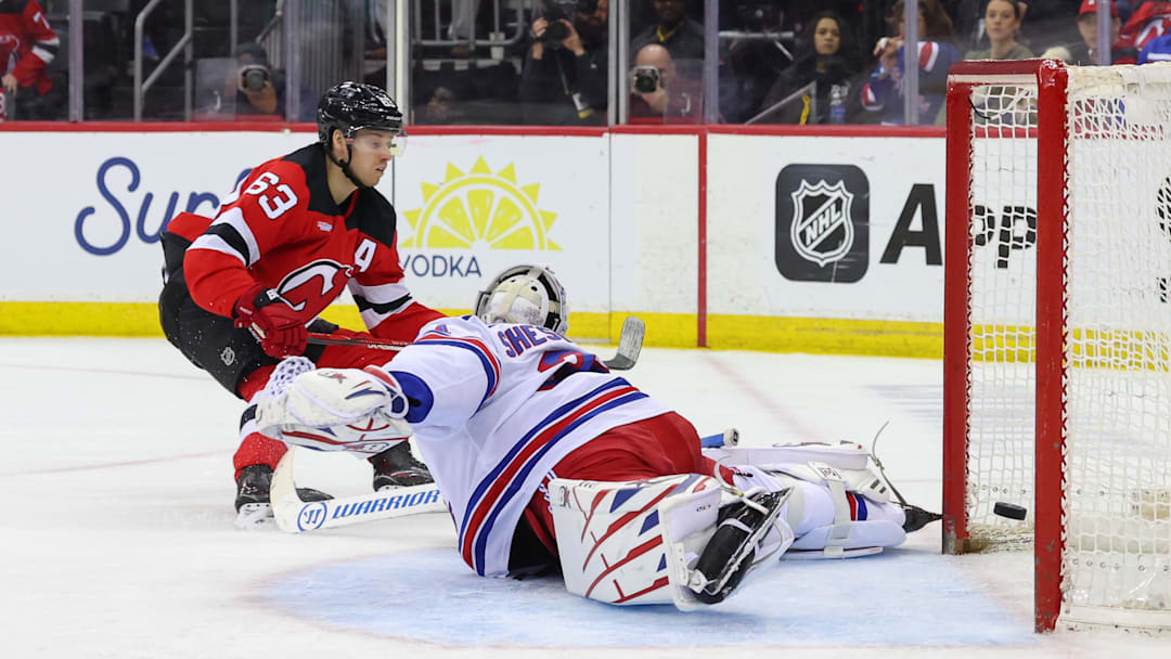 New Jersey Devils left wing Jesper Bratt (63) scores a goal on New York Rangers goaltender Igor Shesterkin (31). Mandatory Credit: Ed Mulholland-Imagn Images