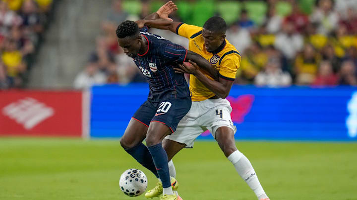 Oct 10, 2025; Austin, Texas, USA; United States forward Folarin Balogun (20) works against Ecuador defender Joel Ordonez (4) during the first half at Q2 Stadium. Mandatory Credit: Scott Coleman-Imagn Images