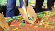Gold shovel with Athletics on it in the dirt as the team's ceremonial groundbreaking in Las Vegas