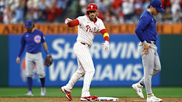 Bryson Stott points to the dugout after making it safely to second base versus the Chicago Cubs.