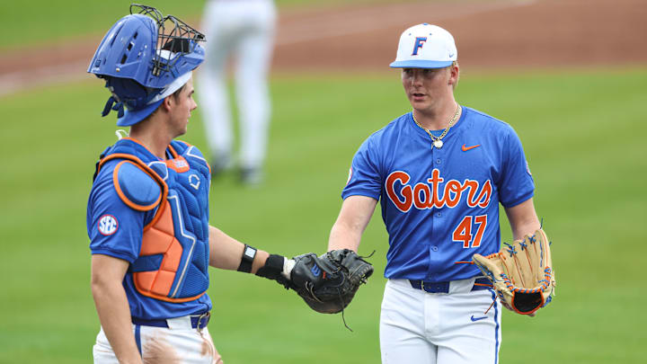 Florida Gators catcher Luke Heyman and pitcher Aidan King during the team's win over Harvard in the first game of Saturday's double-header. Florida Gators catcher Luke Heyman and pitcher Aidan King during the team's win over Harvard in the first game of Saturday's double-header.
