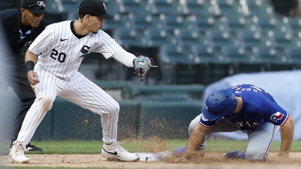 Rangers rookie Wyatt Langford slides into third safely in the seventh inning of Game 1 Wednesday against the White Sox.