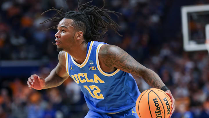 UCLA Bruins guard Sebastian Mack (12) looks to drive on a defender, in a game versus the Tennessee Volunteers this season.