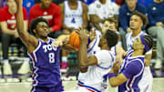 TCU players Ernest Udeh Jr. and David Punch defend against the Kansas Jayhawks. 
