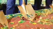 Gold shovel with Athletics on it in the dirt as the team's ceremonial groundbreaking in Las Vegas