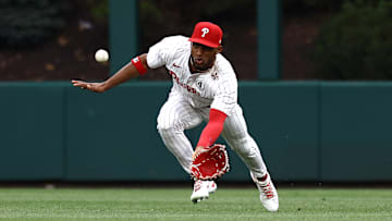 Johan Rojas fields a ball out in center field against the Cardinals.