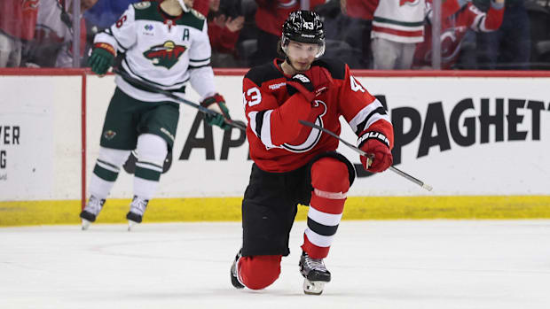 Hockey player celebrates after scoring a goa