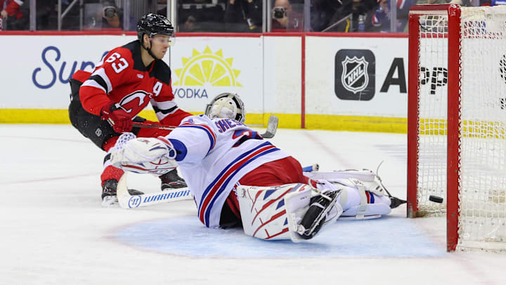 New Jersey Devils left wing Jesper Bratt scores a goal on New York Rangers goaltender Igor Shesterkin.
