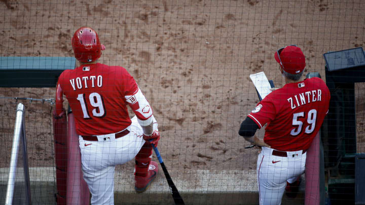 Cincinnati Reds first baseman Joey Votto (19) waits in the dugout in the seventh inning of the baseball game against the Chicago Cubs, Saturday, May 1, 2021, at Great American Ball Park in Cincinnati.