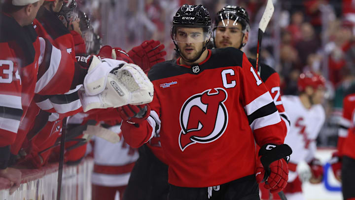 Apr 25, 2025; Newark, New Jersey, USA; New Jersey Devils center Nico Hischier (13) celebrates his goal against the Carolina Hurricanes during the first period in game three of the first round of the 2025 Stanley Cup Playoffs at Prudential Center. Mandatory Credit: Ed Mulholland-Imagn Images