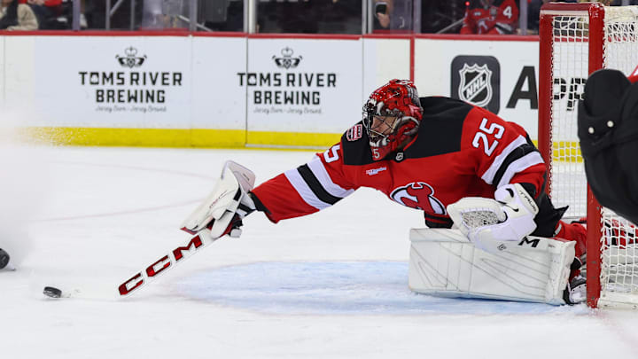 Jan 22, 2025; Newark, New Jersey, USA; New Jersey Devils goaltender Jacob Markstrom (25) makes a save against the Boston Bruins during the first period at Prudential Center. Mandatory Credit: Ed Mulholland-Imagn Images