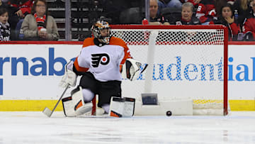 Jan 18, 2025; Newark, New Jersey, USA; Philadelphia Flyers goaltender Samuel Ersson (33) makes a save against the New Jersey Devils during the third period at Prudential Center. Mandatory Credit: Ed Mulholland-Imagn Images