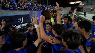 Americas celebrate winning its game against El Dorado for the Class 5A, Division 1 regional title at the Students Activities Complex 2 on March 31, 2025. Americas won 3-0.