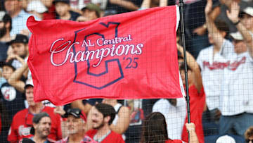 Sep 28, 2025; Cleveland, Ohio, USA;  A member of the Cleveland Strikers waves an American League Central Division champions flag during the game between the Cleveland Guardians and the Texas Rangers at Progressive Field. Mandatory Credit: Ken Blaze-Imagn Images
