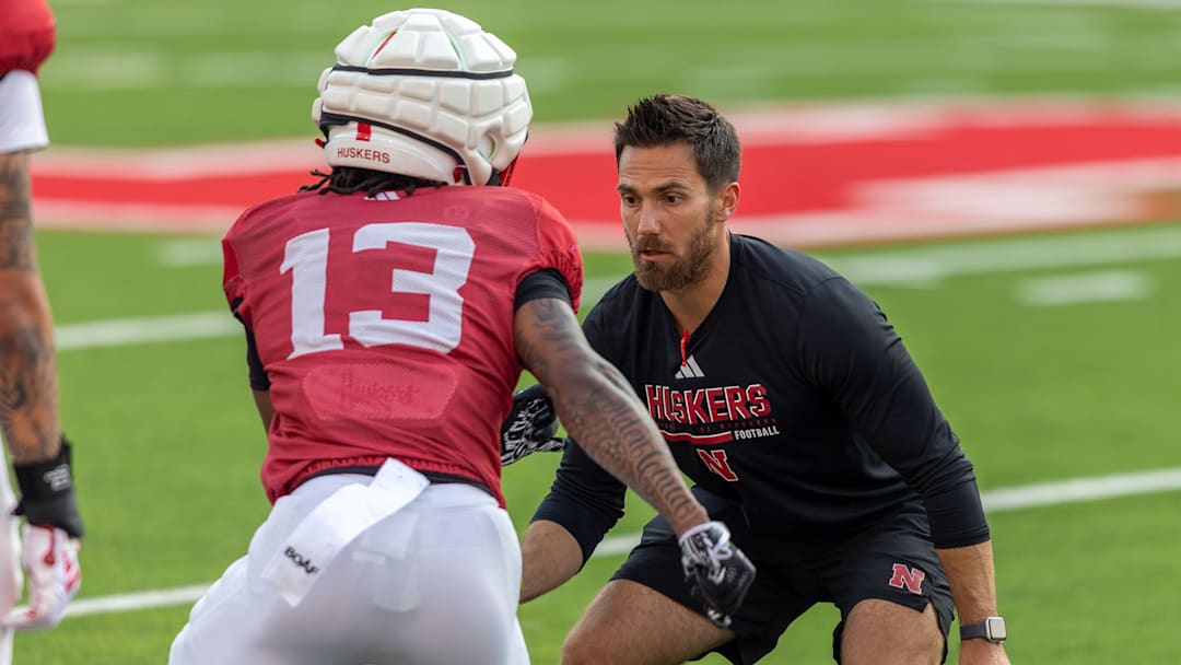 Nebraska assistant wide receivers coach Andrew Verboys works with wideout Nyziah Hunter at the Big Red Preview.