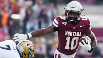 Montana Grizzlies running back Eli Gillman (10) carries the ball against Montana State