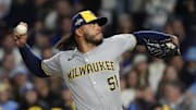Oct 9, 2025; Chicago, Illinois, USA; Milwaukee Brewers pitcher Freddy Peralta (51) throws pitch against the Chicago Cubs during the first inning for game four of the NLDS round for the 2025 MLB playoffs at Wrigley Field. Mandatory Credit: David Banks-Imagn Images