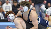 Mitchell Mesenbrink of the Penn State Nittany Lions celebrates his win over Iowa's Michael Caliendo during the 2025 Division I Men's Wrestling Championship in Philadelphia. 