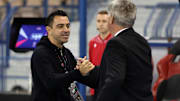 Xavi y Ancelotti