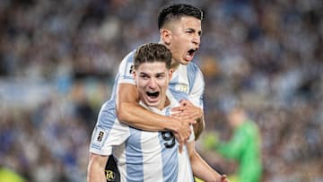 Julián Alvarez of Argentina celebrates with Thiago Almada...