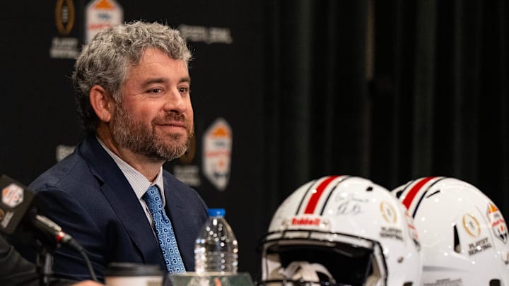 Ole Miss Head Coach Pete Golding smiles while Miami Head Coach Mario Cristobal answers a question during a CFP and Fiesta Bowl press conference at the JW Marriott Scottsdale Camelback Inn Resort & Spa, in Scottsdale, Ariz., on Wednesday, Jan. 7, 2026.