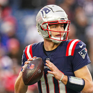 New England Patriots quarterback Drake Maye looks to throw a pass.