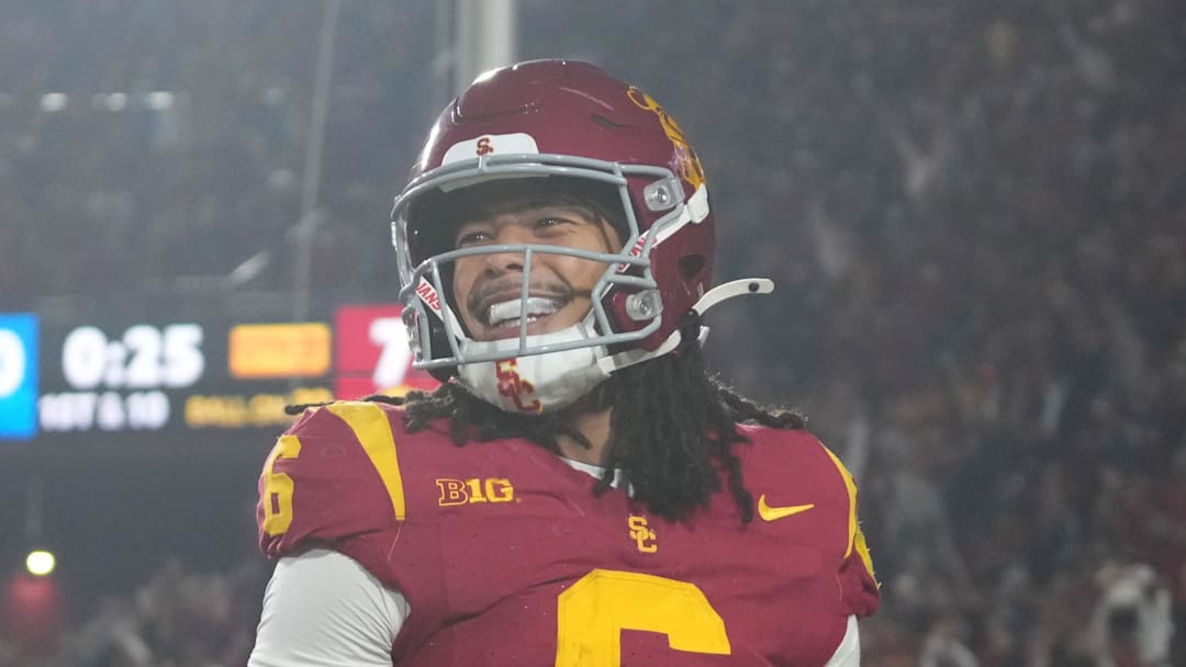 Nov 29, 2025; Los Angeles, California, USA; Southern California Trojans wide receiver Makai Lemon (6) celebrates after catching a 32-yard touchdown pass against the UCLA Bruins in the second half at United Airlines Field at Los Angeles Memorial Coliseum. Mandatory Credit: Kirby Lee-Imagn Images
