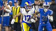 Jan 14, 2024; Detroit, Michigan, USA; Los Angeles Rams wide receiver Puka Nacua (17) runs from Detroit Lions safety Kerby Joseph (31) during the second half of a 2024 NFC wild card game at Ford Field. Mandatory Credit: David Reginek-Imagn Images