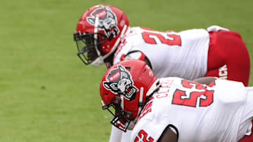 Oct 10, 2020; Charlottesville, Virginia, USA; The Virginia Cavaliers offense lines up against the North Carolina State Wolfpack defense in the fourth quarter at Scott Stadium. Mandatory Credit: Geoff Burke-Imagn Images