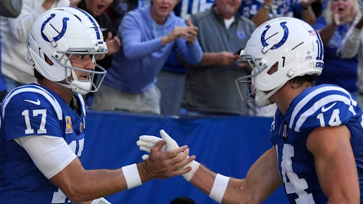 Oct 12, 2025; Indianapolis, Indiana, USA; Indianapolis Colts quarterback Daniel Jones (17) celebrates with wide receiver Alec Pierce (14) after Jones scores a touchdown during a game against the Arizona Cardinals at Lucas Oil Stadium. Mandatory Credit: Christine Tannous-USA TODAY Network via Imagn Images