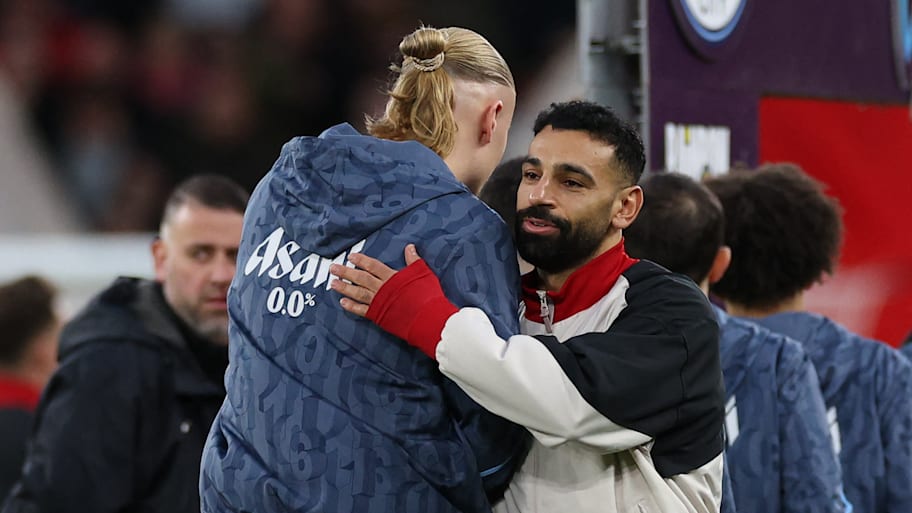 Erling Haaland (left) and Mohamed Salah hugging.