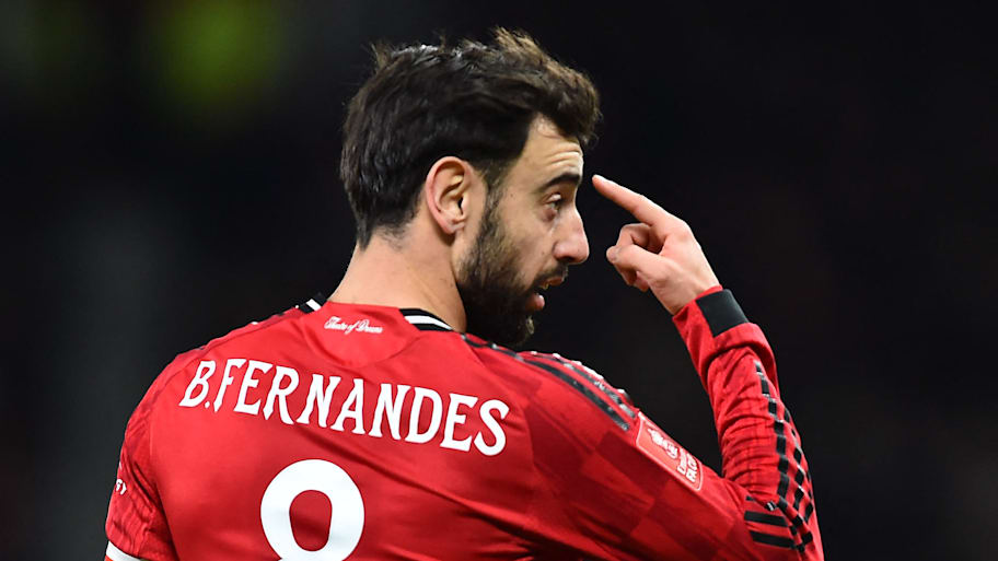 Bruno Fernandes pointing to his head.