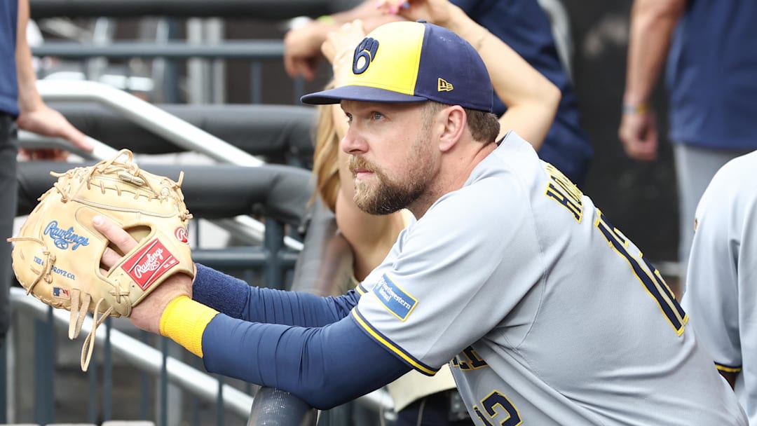 Jul 2, 2025; New York City, New York, USA;  Milwaukee Brewers first baseman Rhys Hoskins (12) watches from the dugout prior to game against the New York Mets at Citi Field. Mandatory Credit: Wendell Cruz-Imagn Images