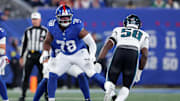 Oct 9, 2025; East Rutherford, New Jersey, USA; New York Giants offensive tackle Andrew Thomas (78) blocks against Philadelphia Eagles linebacker Jalyx Hunt (58) during the first quarter at MetLife Stadium.